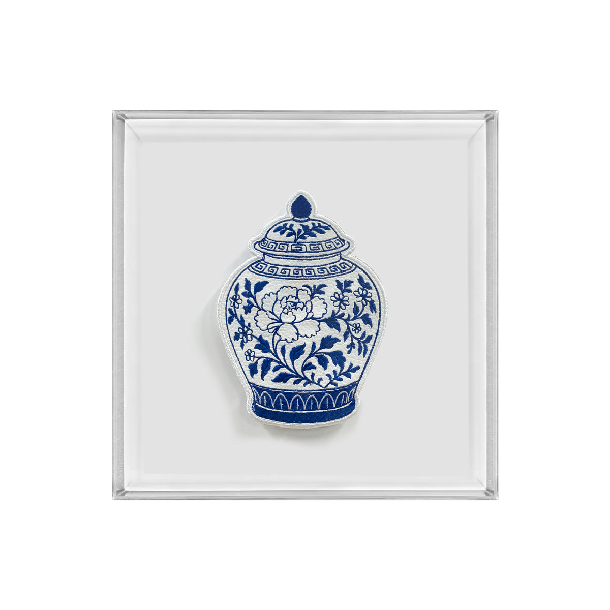 A square white tray with a silver-toned metallic border, featuring a blue and white porcelain-style floral vase illustration in the center.