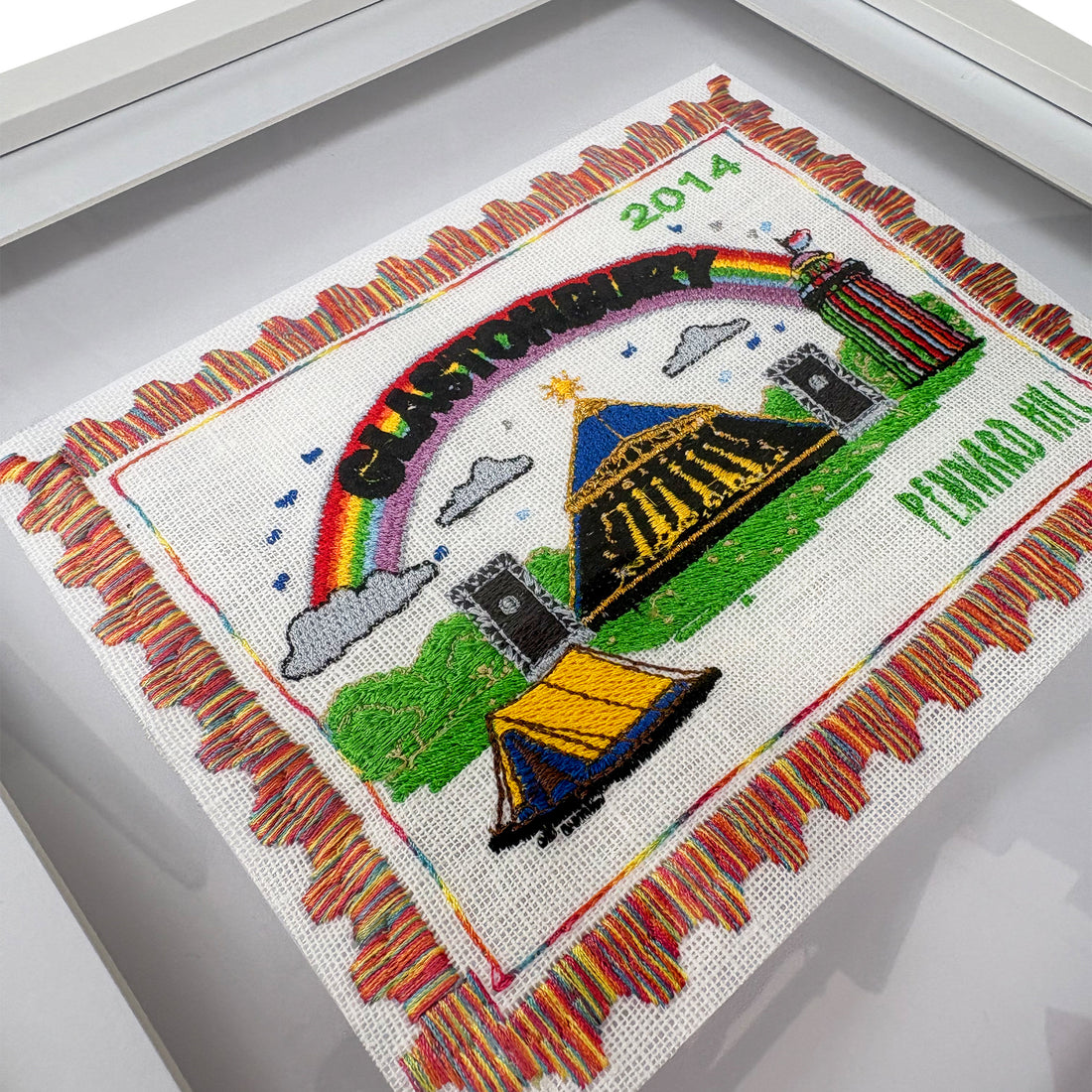 Colorful Glastonbury Embroidered Stamp Artwork by Lillyloves featuring intricate embroidery and vibrant design details.