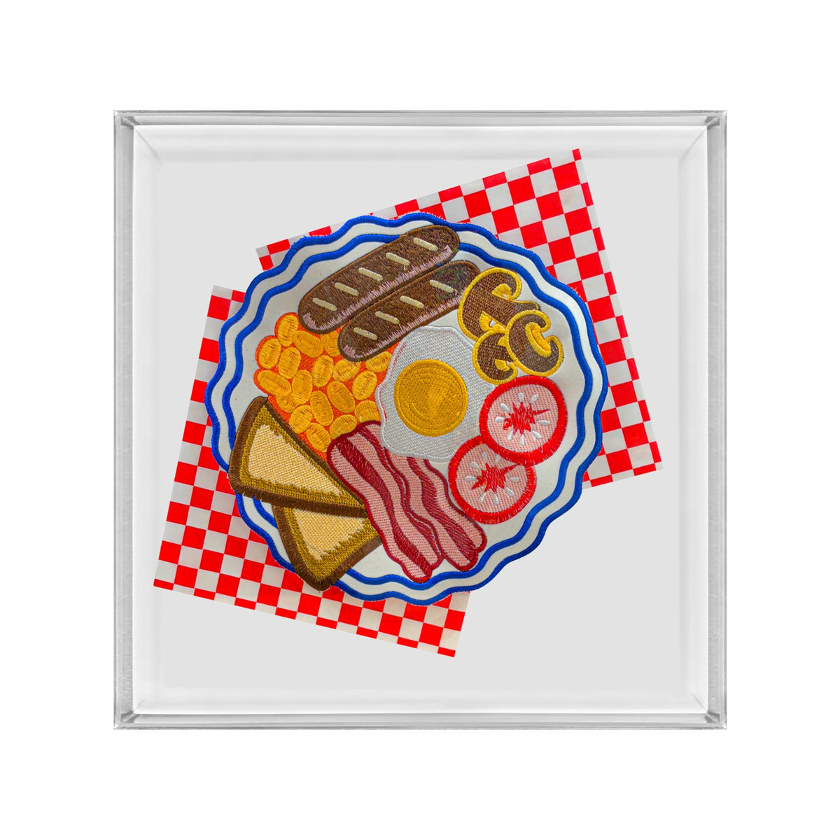 A square glass or acrylic tray with a silver-toned rim, featuring a colorful illustration of a breakfast plate with eggs, bacon, toast, beans, and tomato on a red-and-white checkered napkin.