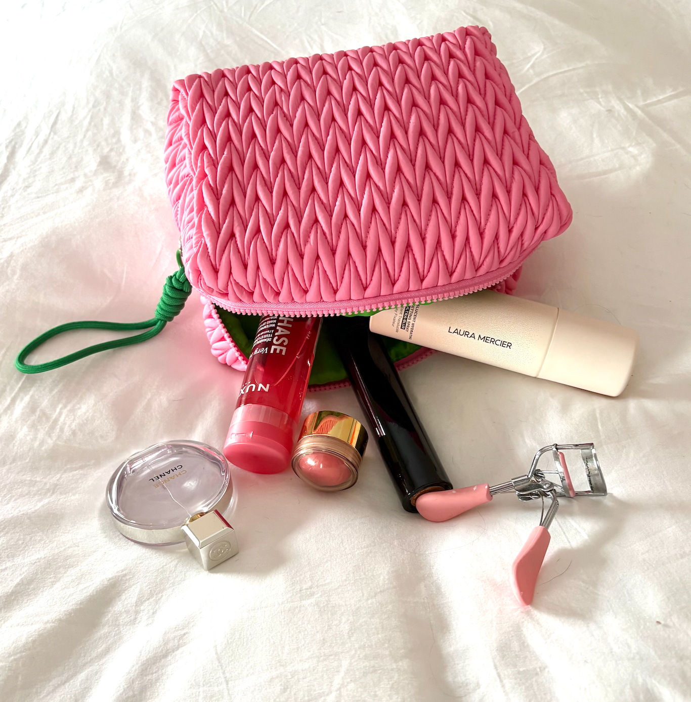 Pink squishy makeup bag by Lillyloves, soft and flexible wash bag with a cute, textured surface for storing cosmetics.