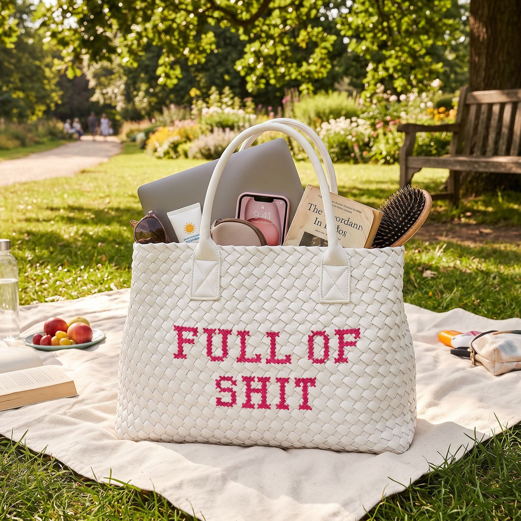 White vegan woven handbag by Lilly Loves with pink accents, featuring a textured handwoven design and stylish full of shit graphic.