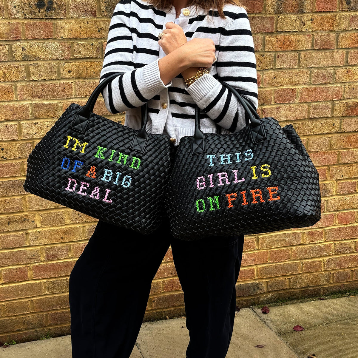 Lilly Loves I'm Kind Of A Big Deal handbag in black with bold white text, featuring a structured design and top handle.
