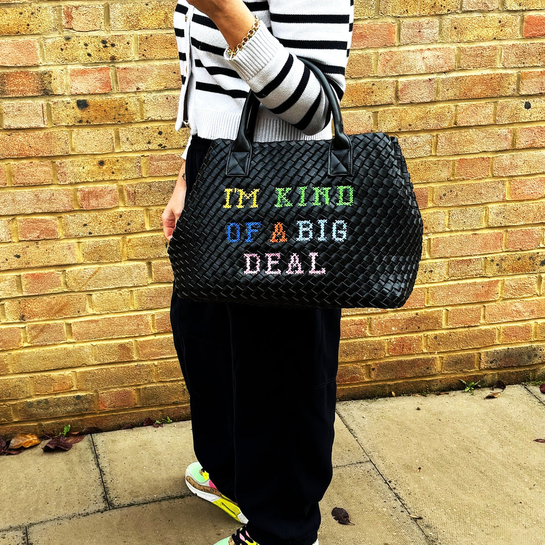 Lilly Loves "I'm Kind Of A Big Deal" handbag with bold text design, stylish accessory for casual or dressy outfits.