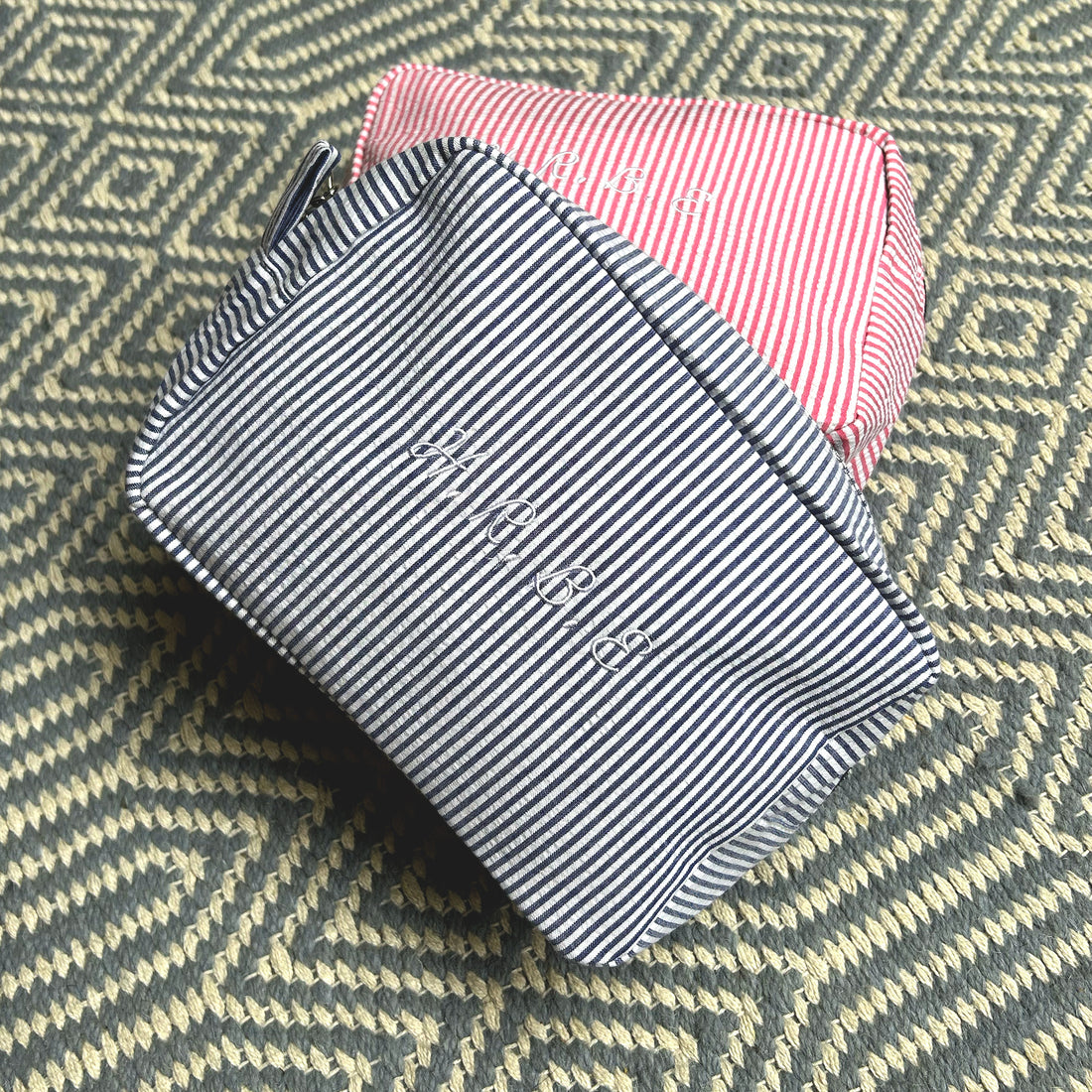 Monogramed stripe cosmetic bag