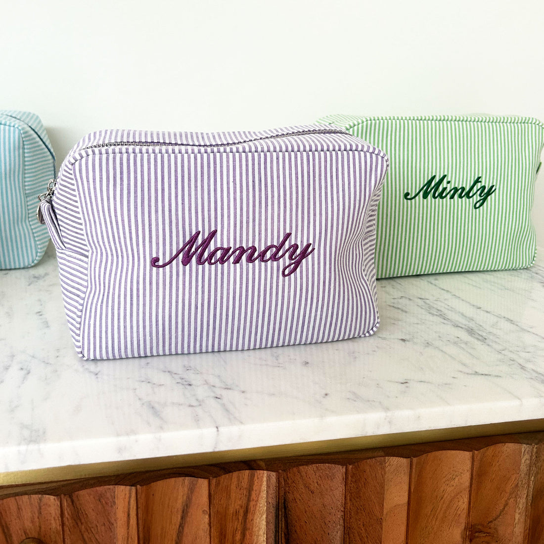 Monogramed stripe cosmetic bag