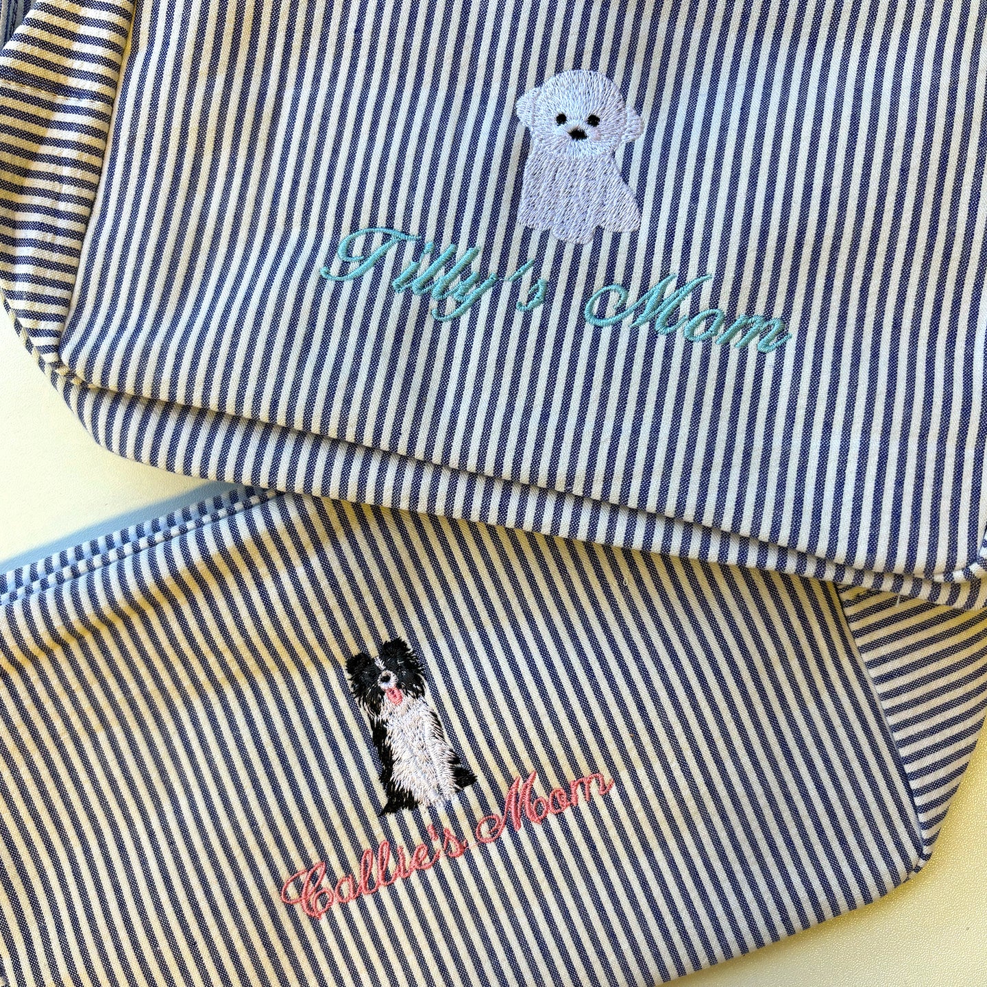Pair of Lilly Loves Doggie Washbags with cute dog illustrations, ideal for washing and protecting small pet accessories.