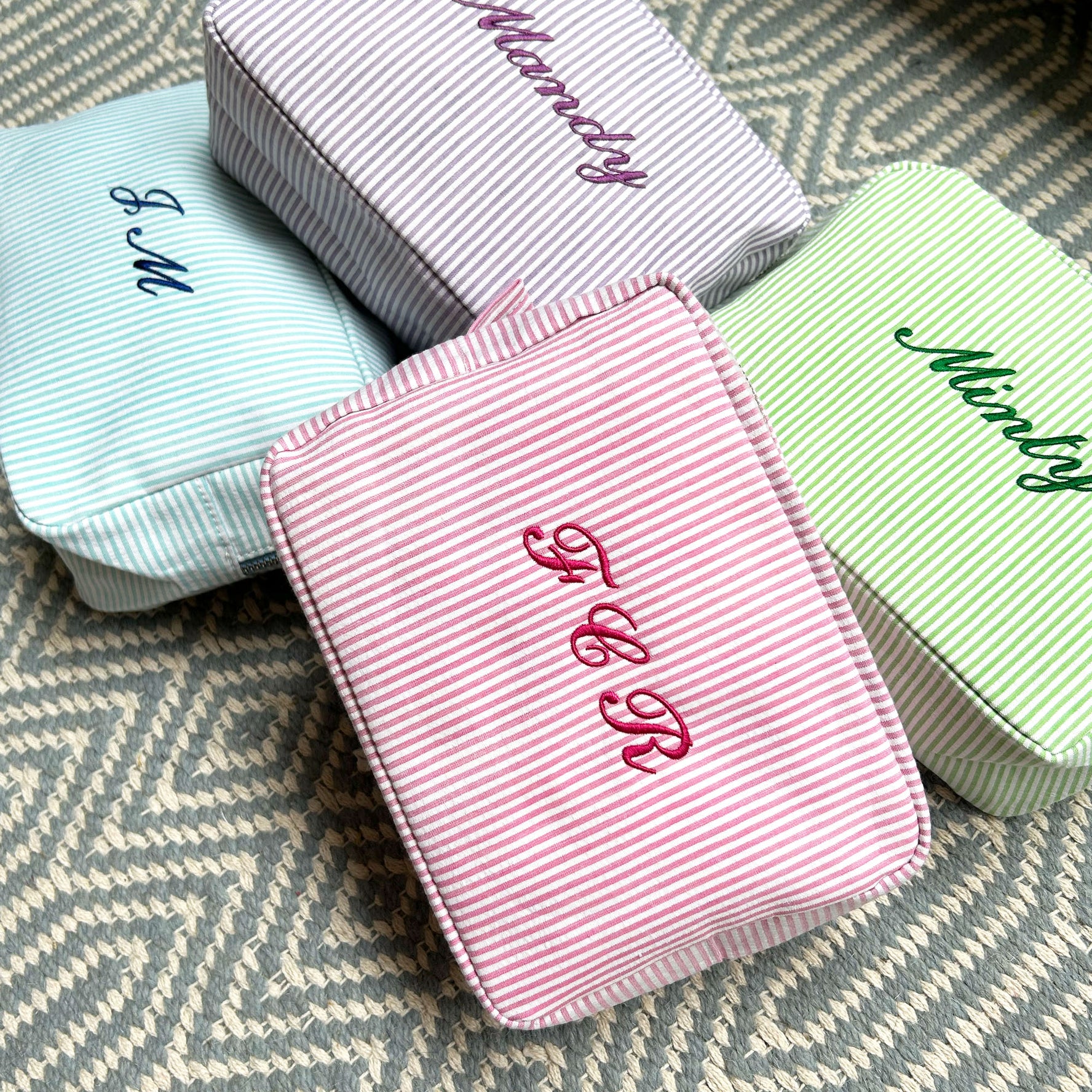 Monogramed stripe cosmetic bag