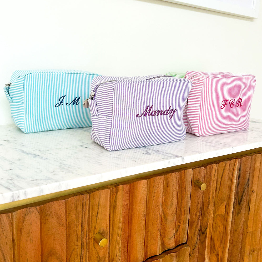 Monogramed stripe cosmetic bag