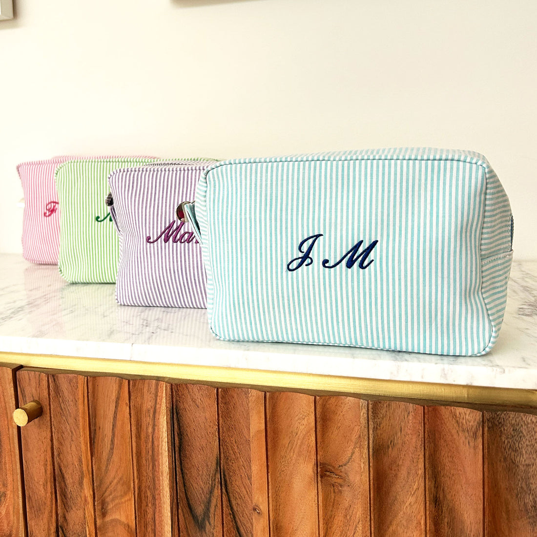 Monogramed stripe cosmetic bag