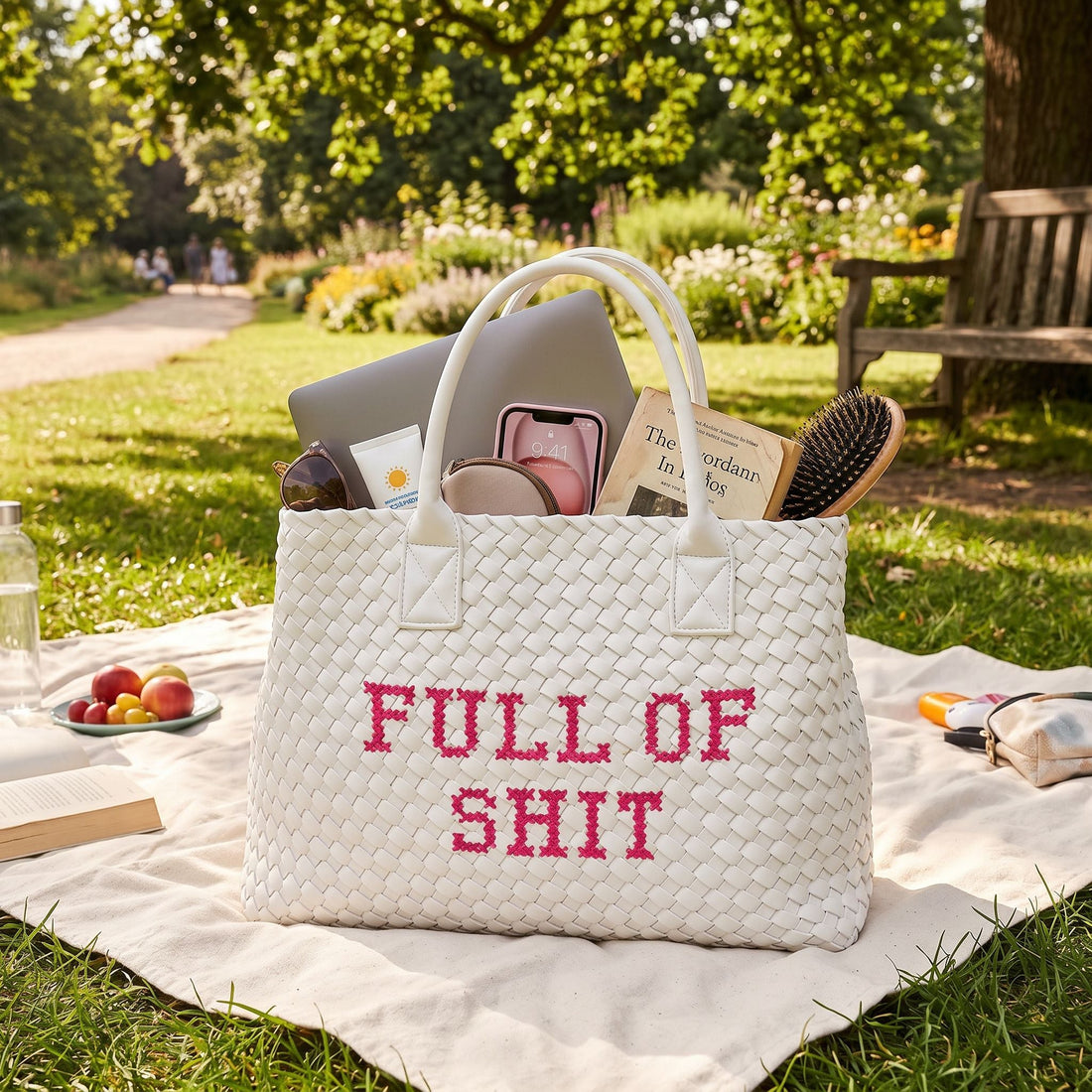 White vegan woven handbag by Lilly Loves with pink accents, featuring a textured handwoven design and stylish full of shit graphic.