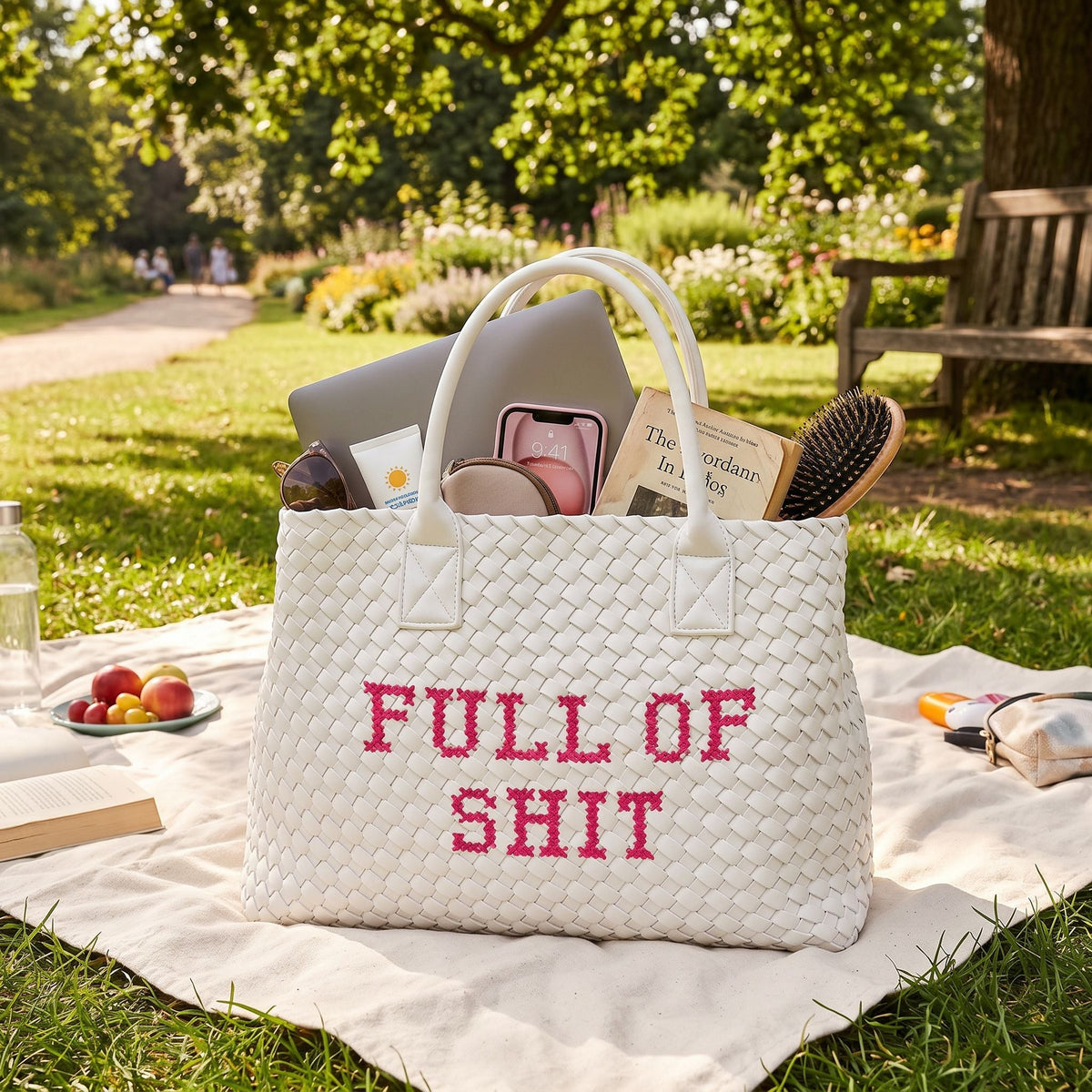 White vegan woven handbag by Lilly Loves with pink accents, featuring a textured handwoven design and stylish full of shit graphic.